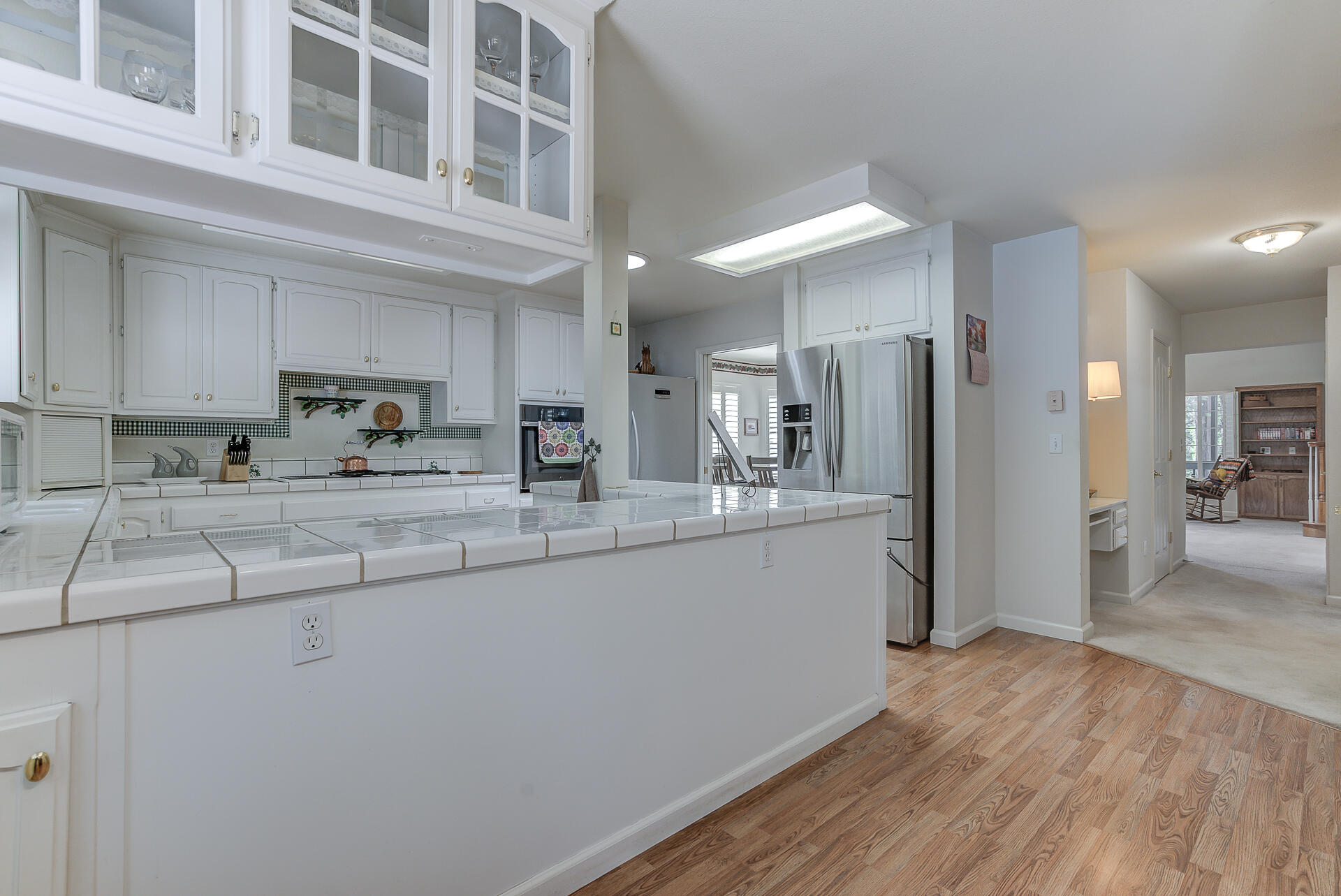 8303 Amberwoods Place Shingletown, CA 96088 - Photo 25 of 58 a kitchen with stainless steel appliances granite countertop a refrigerator a sink a stove and oven with wooden floor