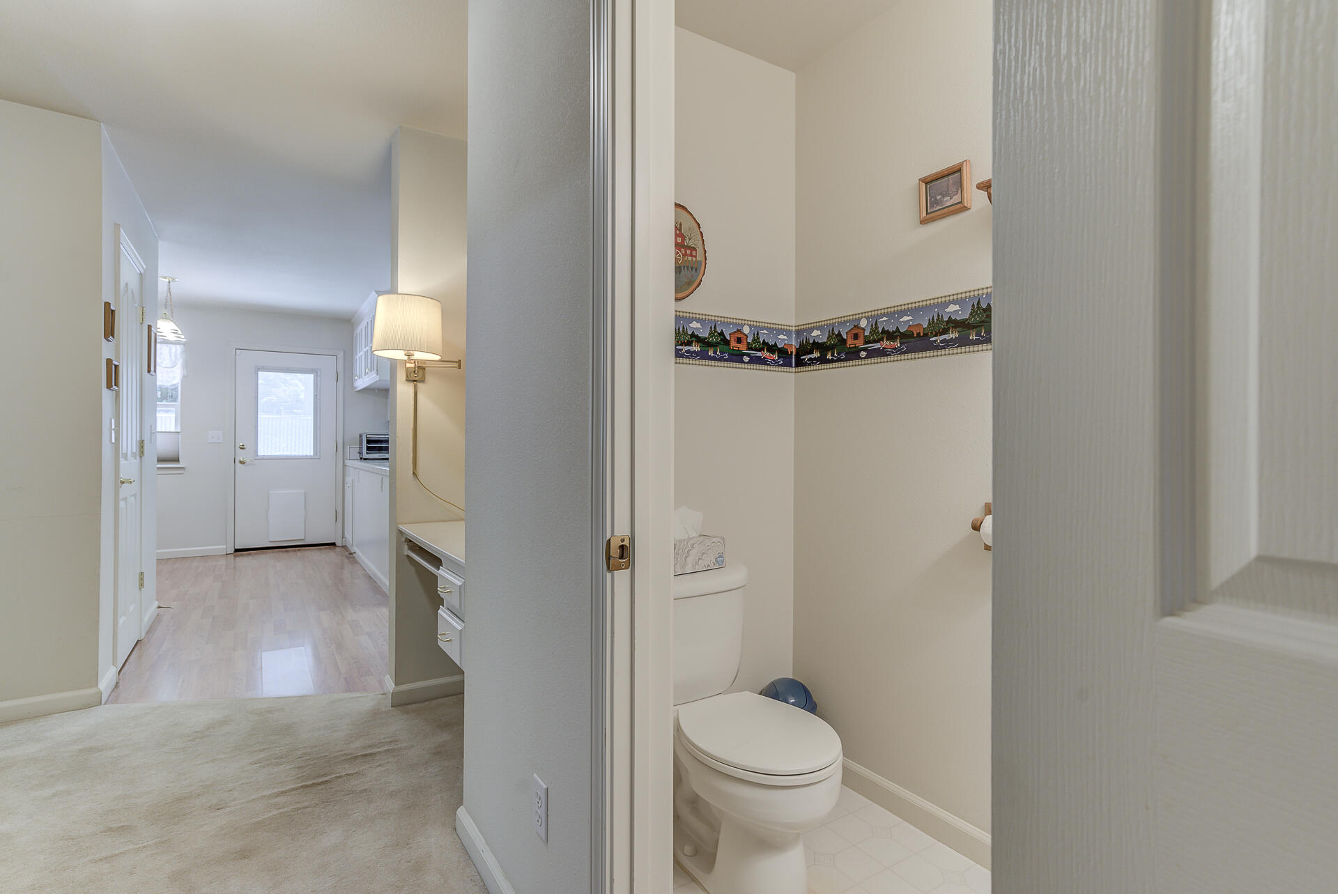 8303 Amberwoods Place Shingletown, CA 96088 - Photo 29 of 58 a bathroom with a granite countertop sink mirror and a toilet
