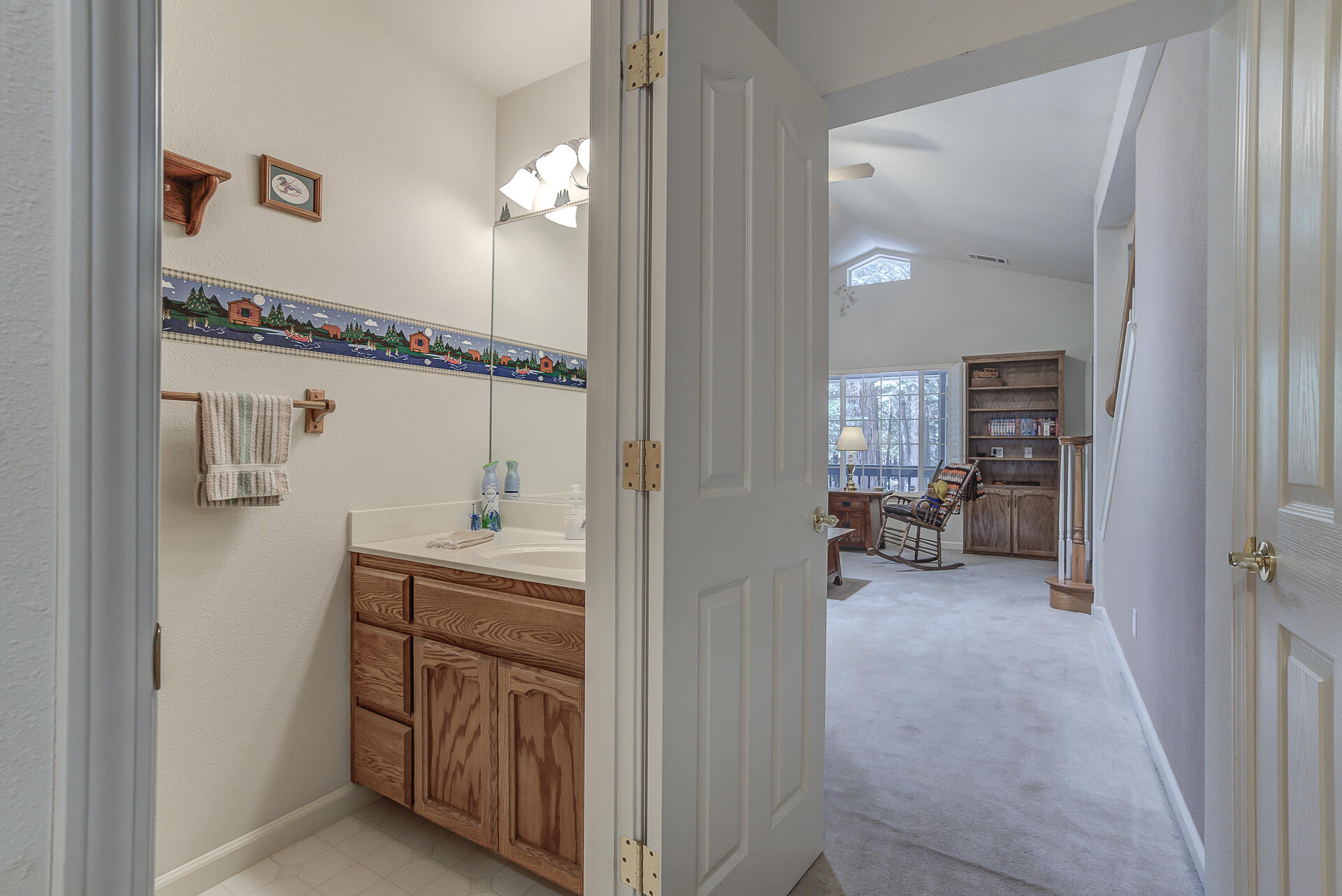 8303 Amberwoods Place Shingletown, CA 96088 - Photo 30 of 58 a en suite bathroom with a sink and mirror with bathtub