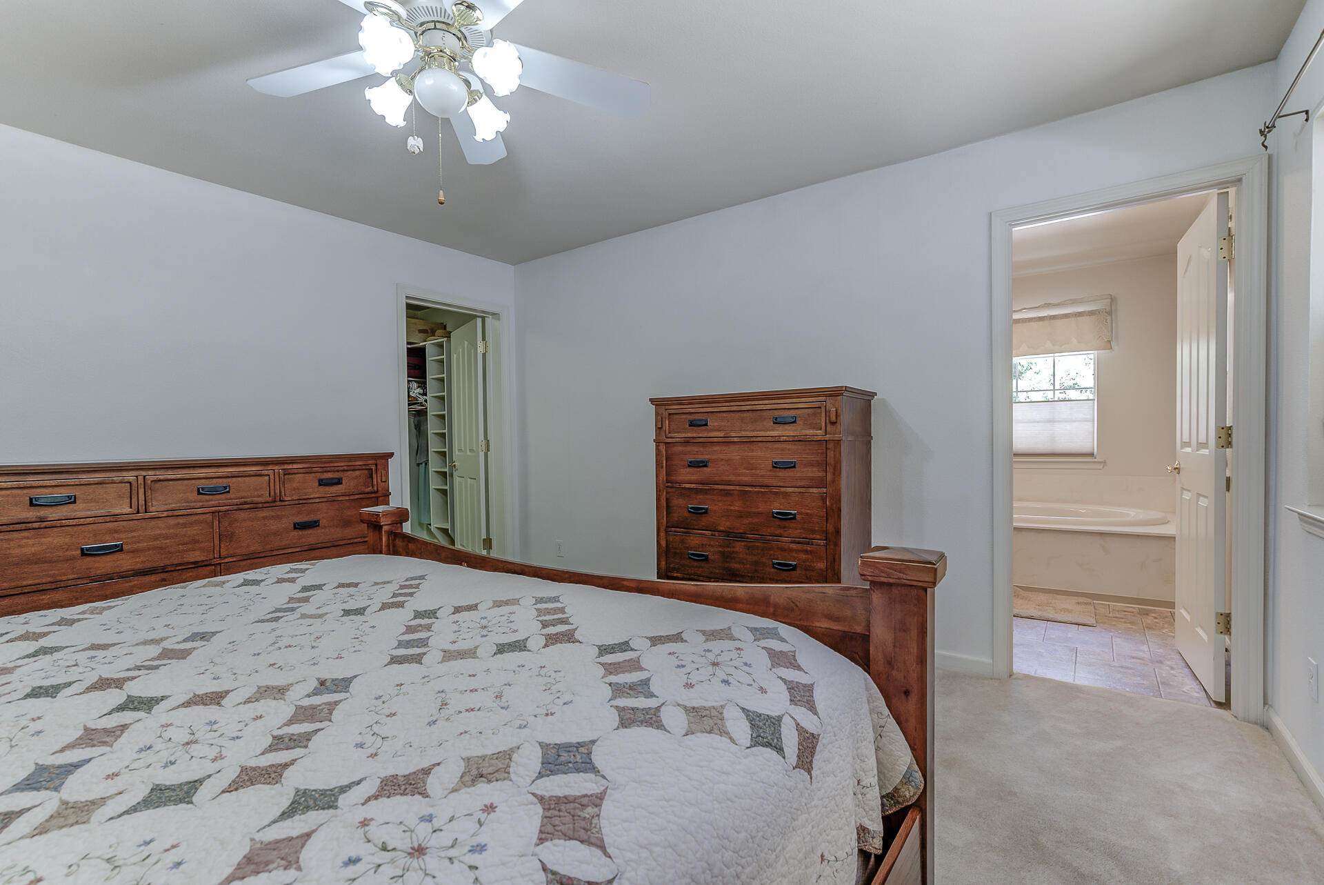 8303 Amberwoods Place Shingletown, CA 96088 - Photo 32 of 58 a bedroom with a bed and a dresser