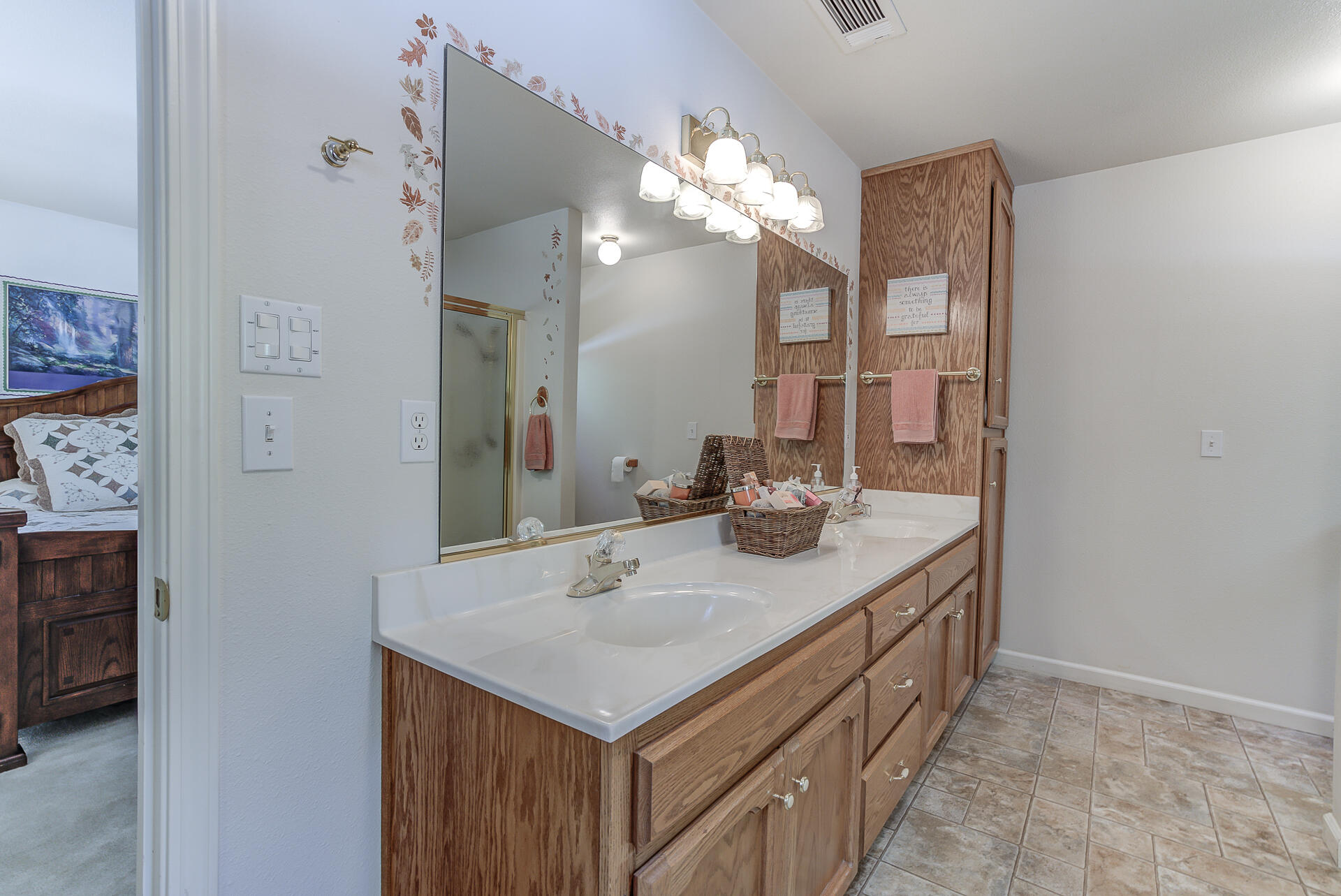 8303 Amberwoods Place Shingletown, CA 96088 - Photo 34 of 58 a bathroom with a sink and a mirror