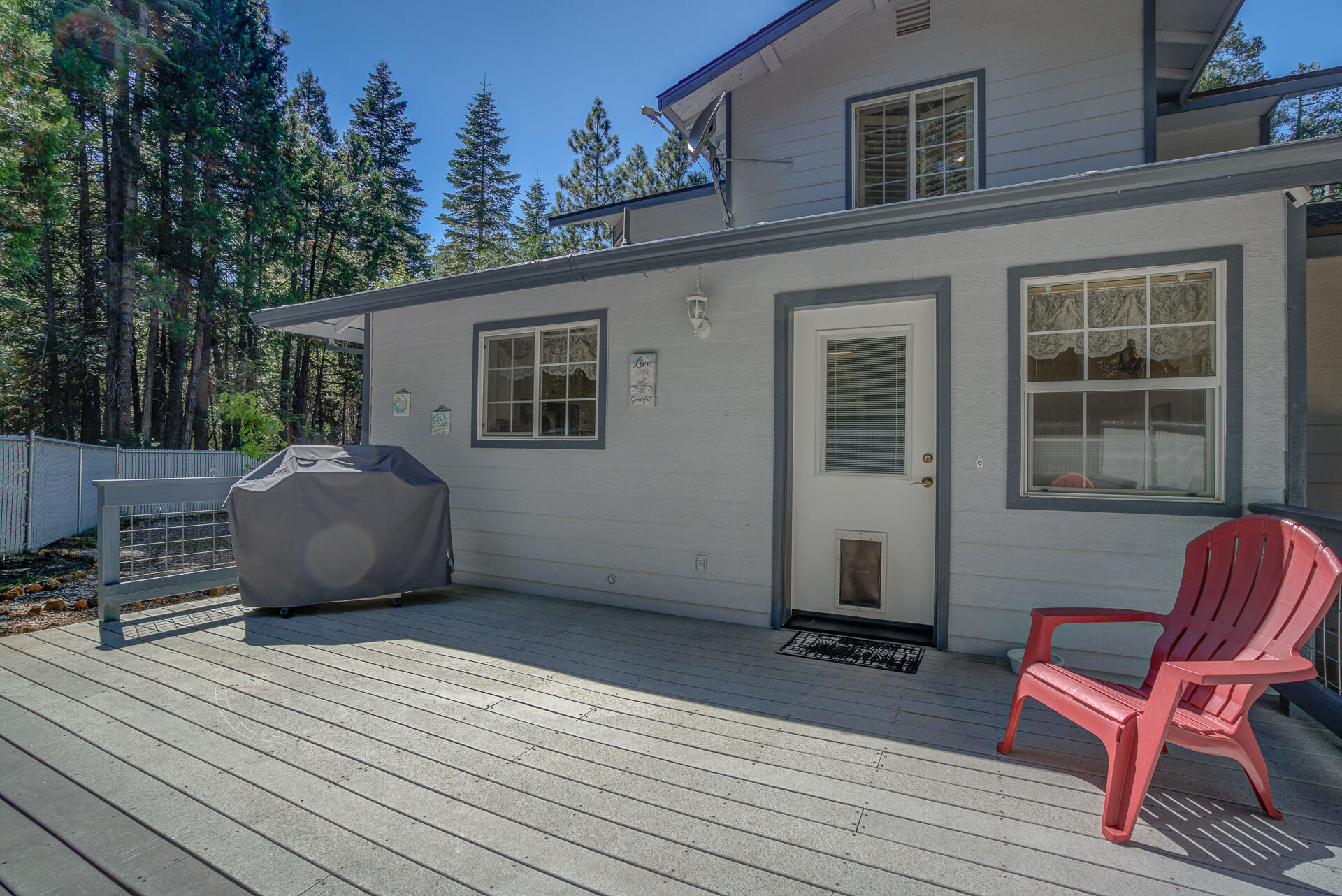 8303 Amberwoods Place Shingletown, CA 96088 - Photo 50 of 58 a view of a deck with chair and wooden floor