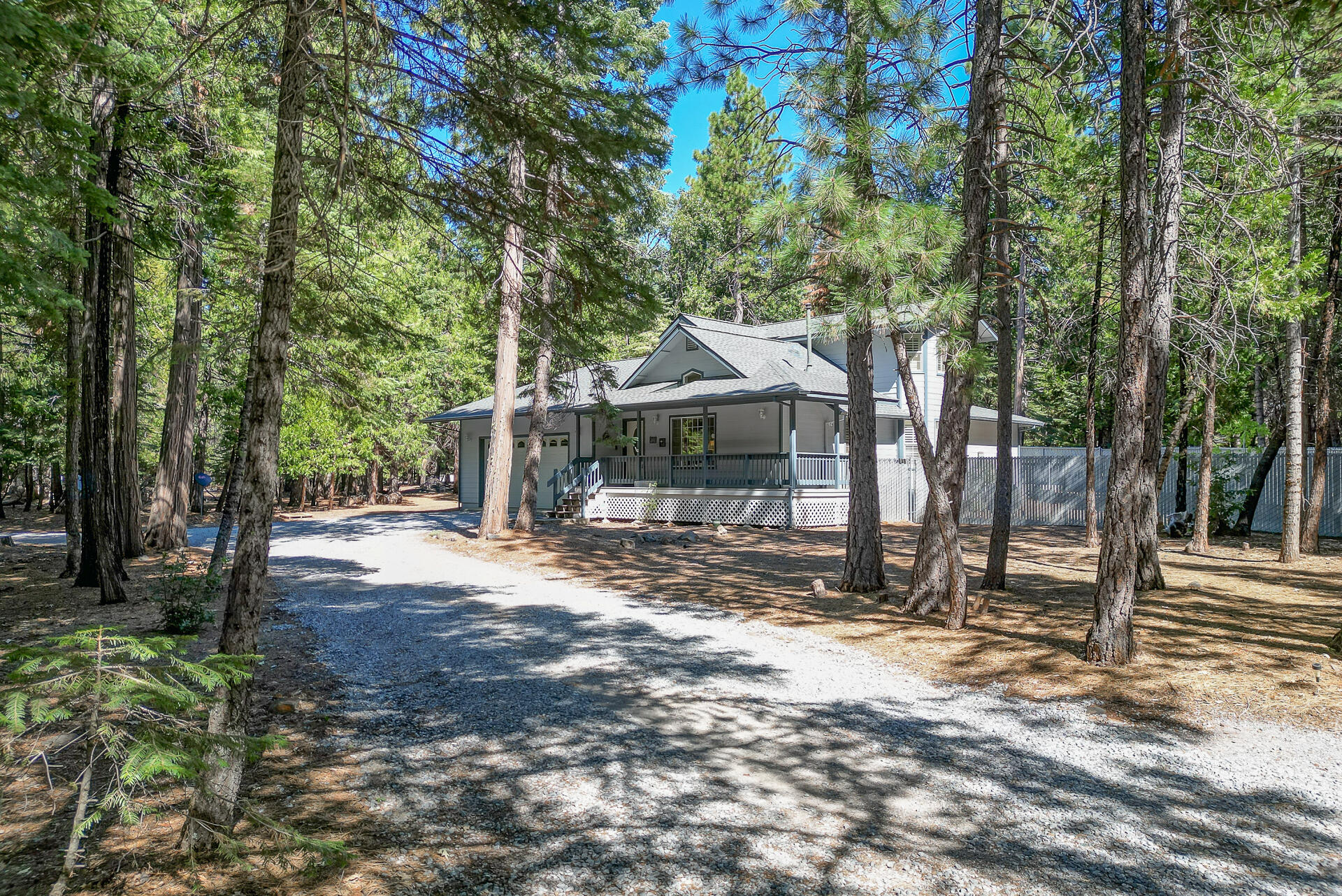 8303 Amberwoods Place Shingletown, CA 96088 - Photo 5 of 58 a front view of a house with a yard