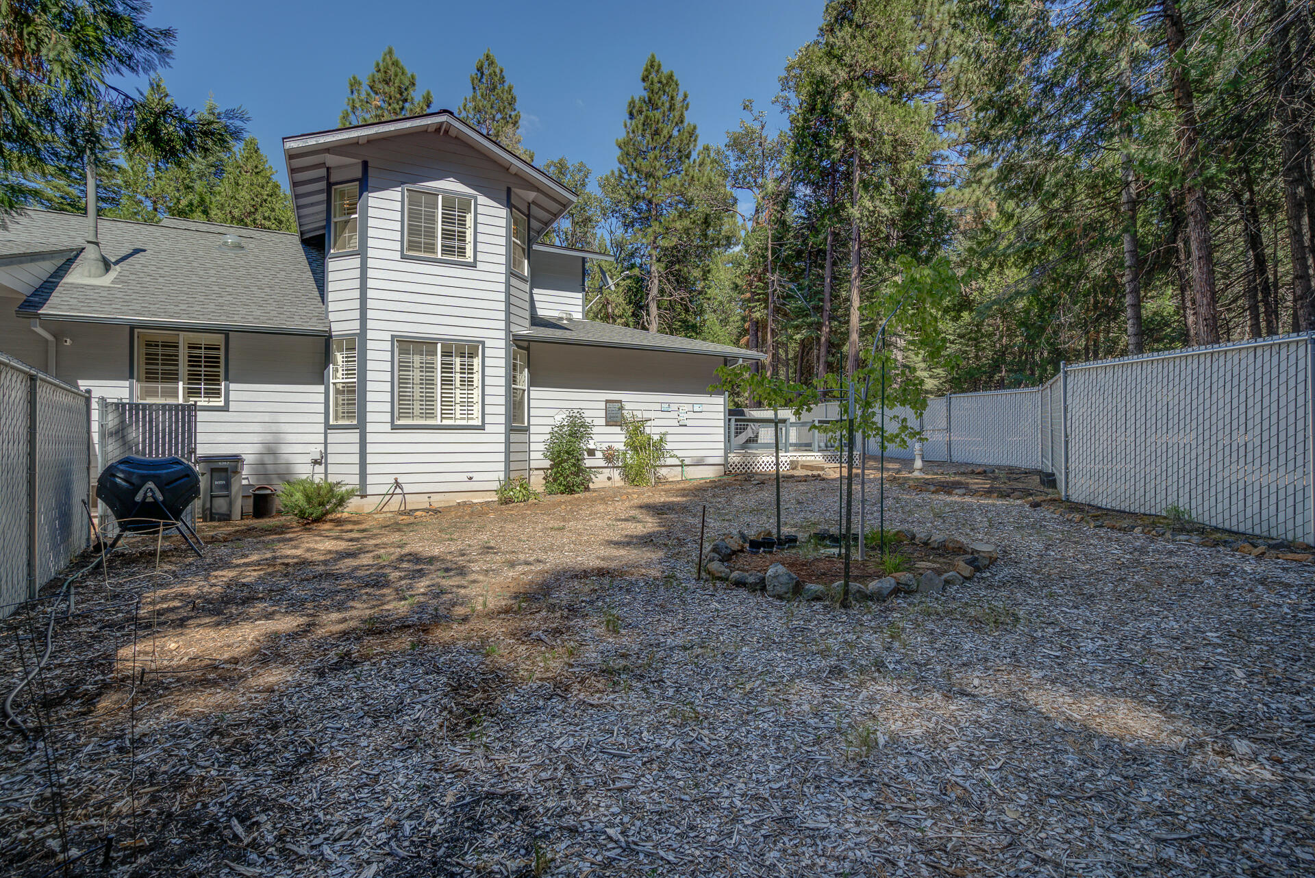 8303 Amberwoods Place Shingletown, CA 96088 - Photo 53 of 58 a front view of a house with a yard