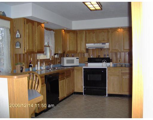 135 Rider Road Westfield, MA 01085 - Photo 15 of 16 a kitchen with stainless steel appliances granite countertop a stove a sink and a refrigerator