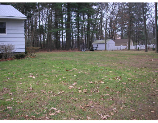 135 Rider Road Westfield, MA 01085 - Photo 4 of 16 a view of a backyard with large trees