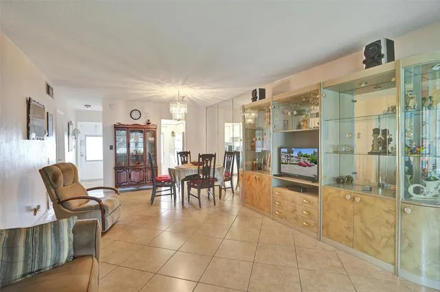 a lobby with furniture and a glass door