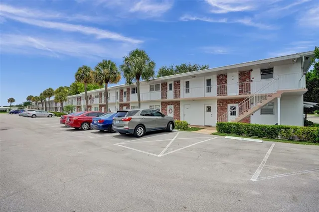 a view of a cars parked in front of a house