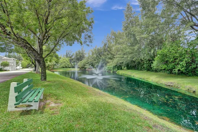 a view of a garden with a lake