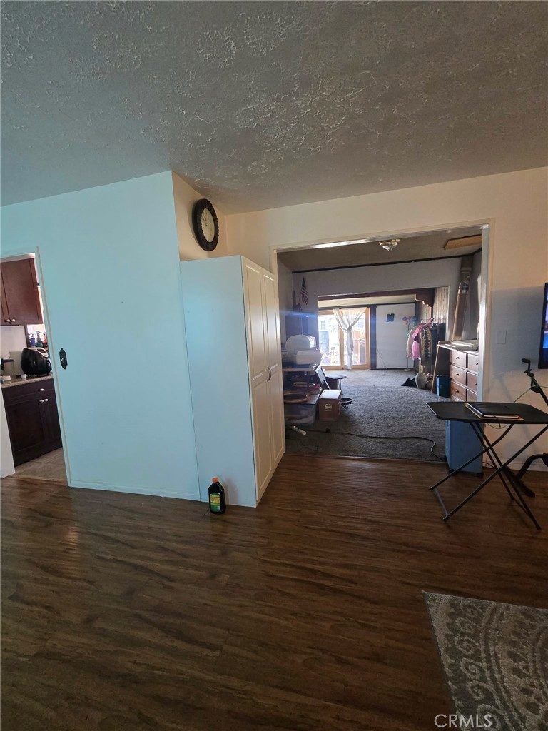 36827 Hidden River Road Hinkley, CA 92347 - Photo 6 of 19 View from walking in the front door; walkway that leads to family room.