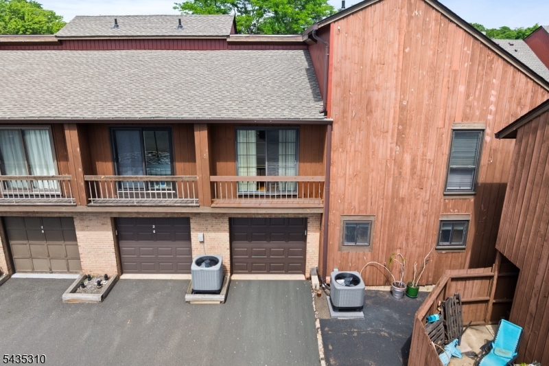 488 Auten Road, Unit 2D Hillsborough, NJ 08844 - Photo 27 of 30 a front view of a house with parking area