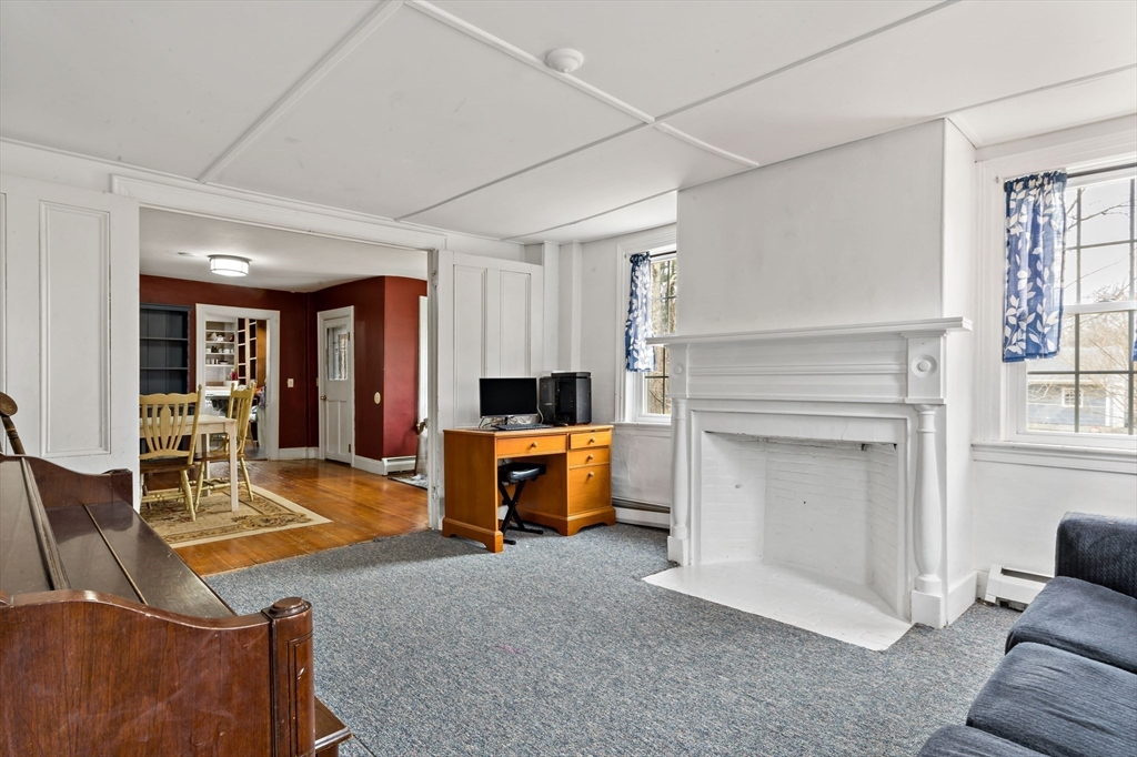 1067 Middle Street Dighton, MA 02764 - Photo 11 of 42 a living room with furniture and a fireplace