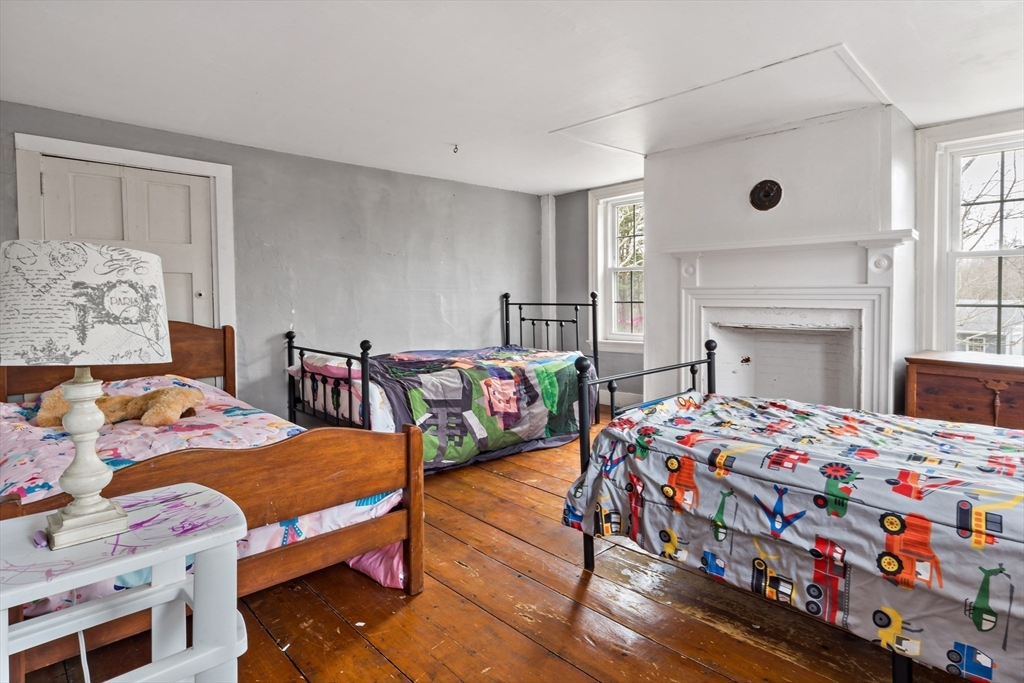 1067 Middle Street Dighton, MA 02764 - Photo 20 of 42 a bedroom with a bed and a dresser in it
