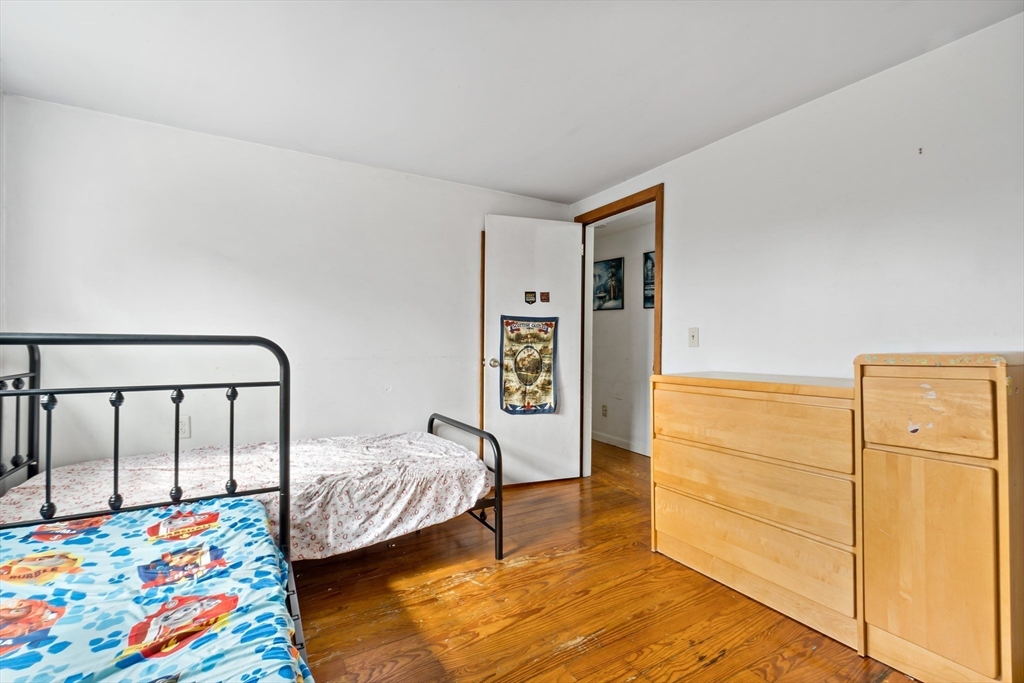 1067 Middle Street Dighton, MA 02764 - Photo 24 of 42 a bedroom with a bed and a dresser