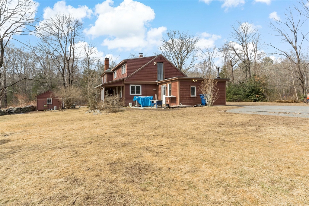 1067 Middle Street Dighton, MA 02764 - Photo 37 of 42 a front view of a house with a yard covered with snow
