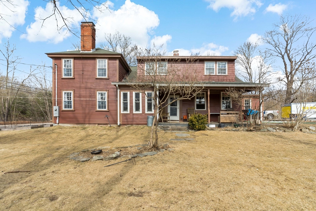 1067 Middle Street Dighton, MA 02764 - Photo 39 of 42 a view of a house with basket ball court and wooden fence