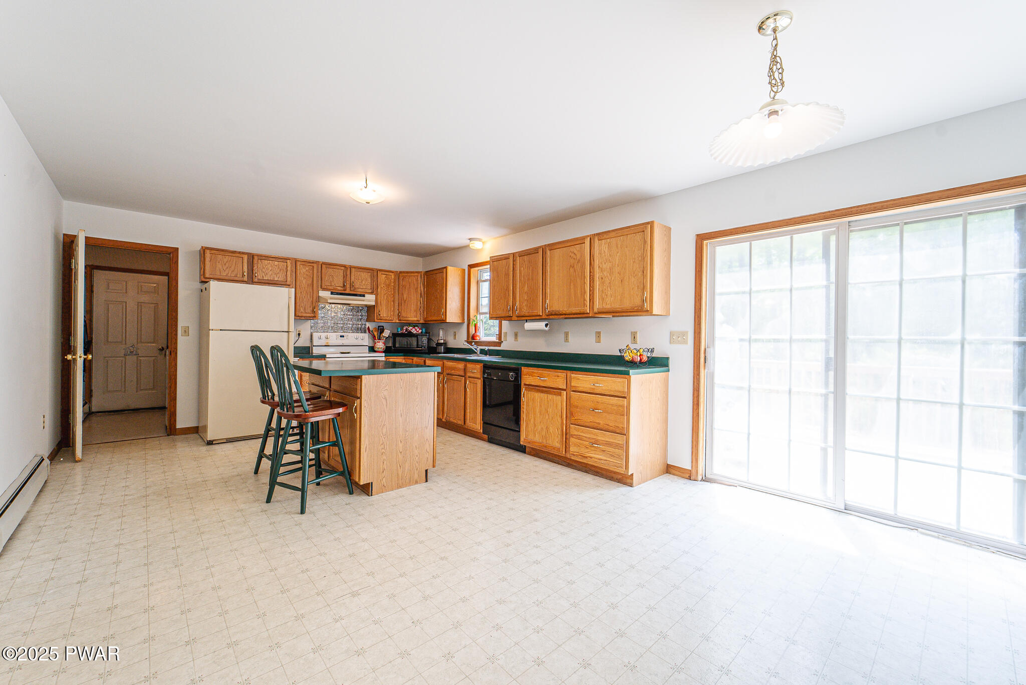 101 Maple Ridge Road Milford, PA 18337 - Photo 16 of 39 a kitchen with stainless steel appliances kitchen island granite countertop a refrigerator and cabinets