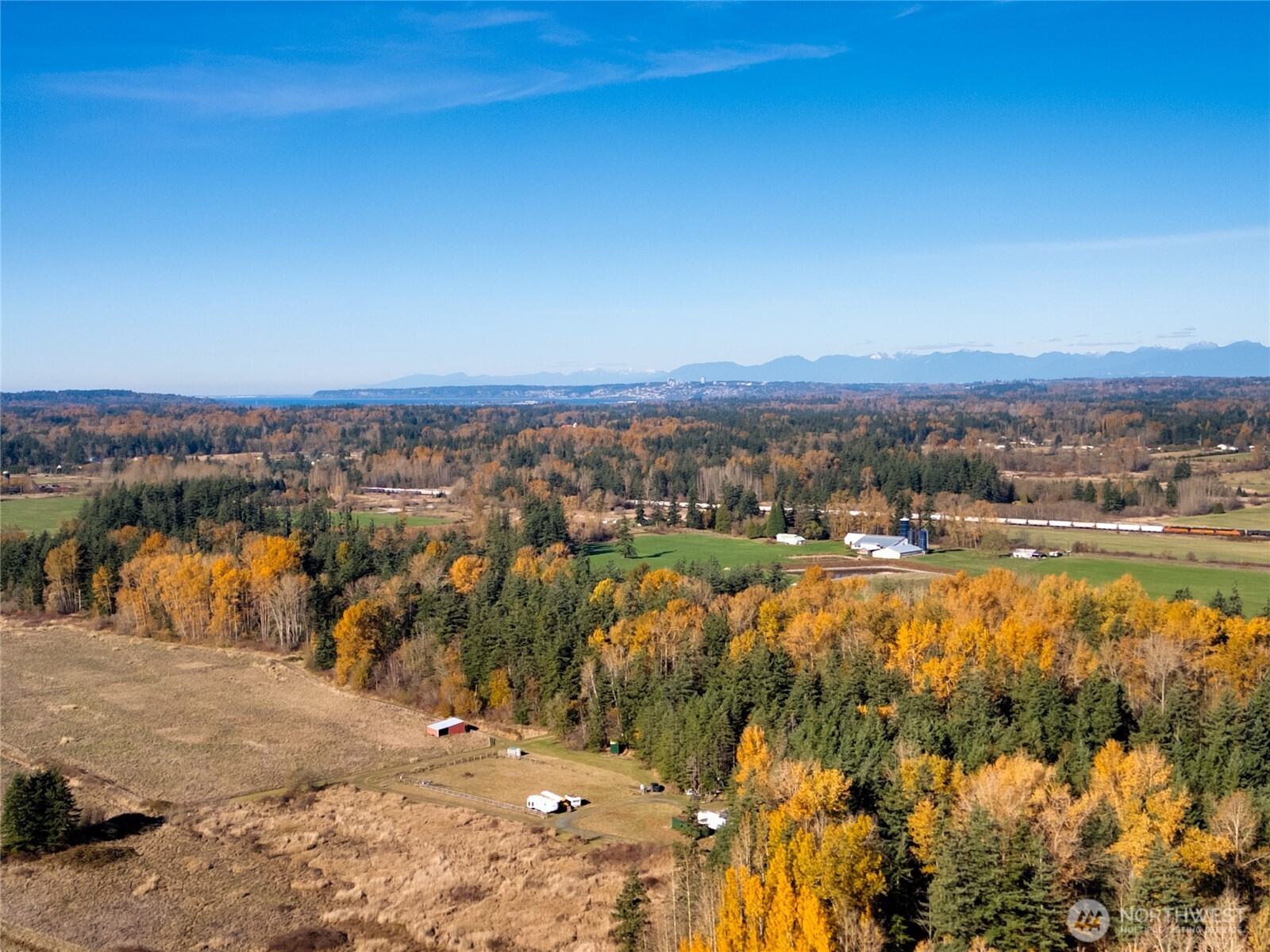 7475 Valley View Road Ferndale, WA 98248 - Photo 7 of 7 a view of a lake with mountains in the background