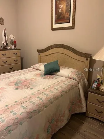 a bedroom with a bed and closet