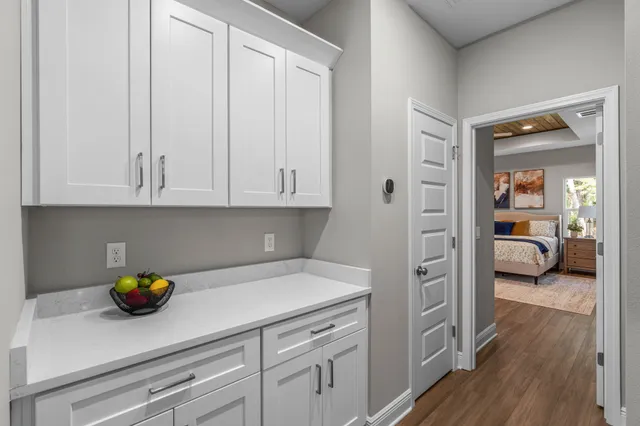 a kitchen with a refrigerator and a stove