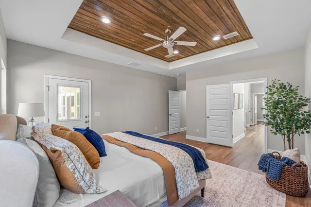 a bedroom with bed and balcony