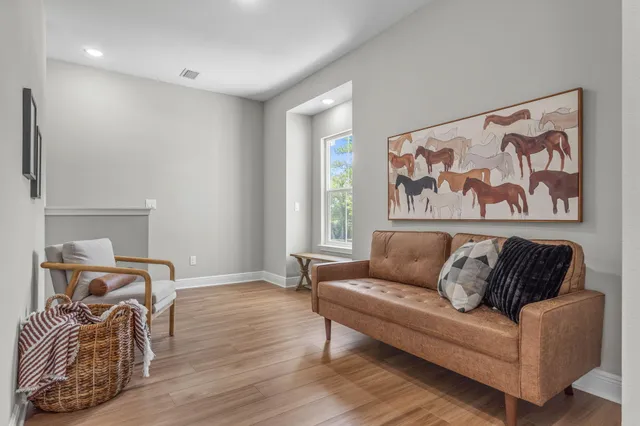 a living room with furniture and a window