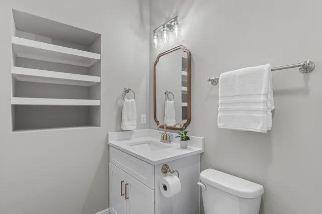 a bathroom with a sink and a toilet