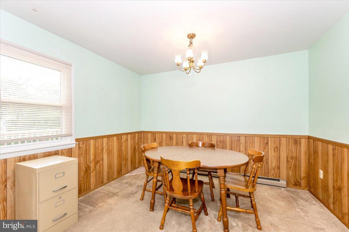 52 Wenner Drive Brunswick, MD 21716 - Photo 15 of 55 a view of a dining room with furniture and wooden floor
