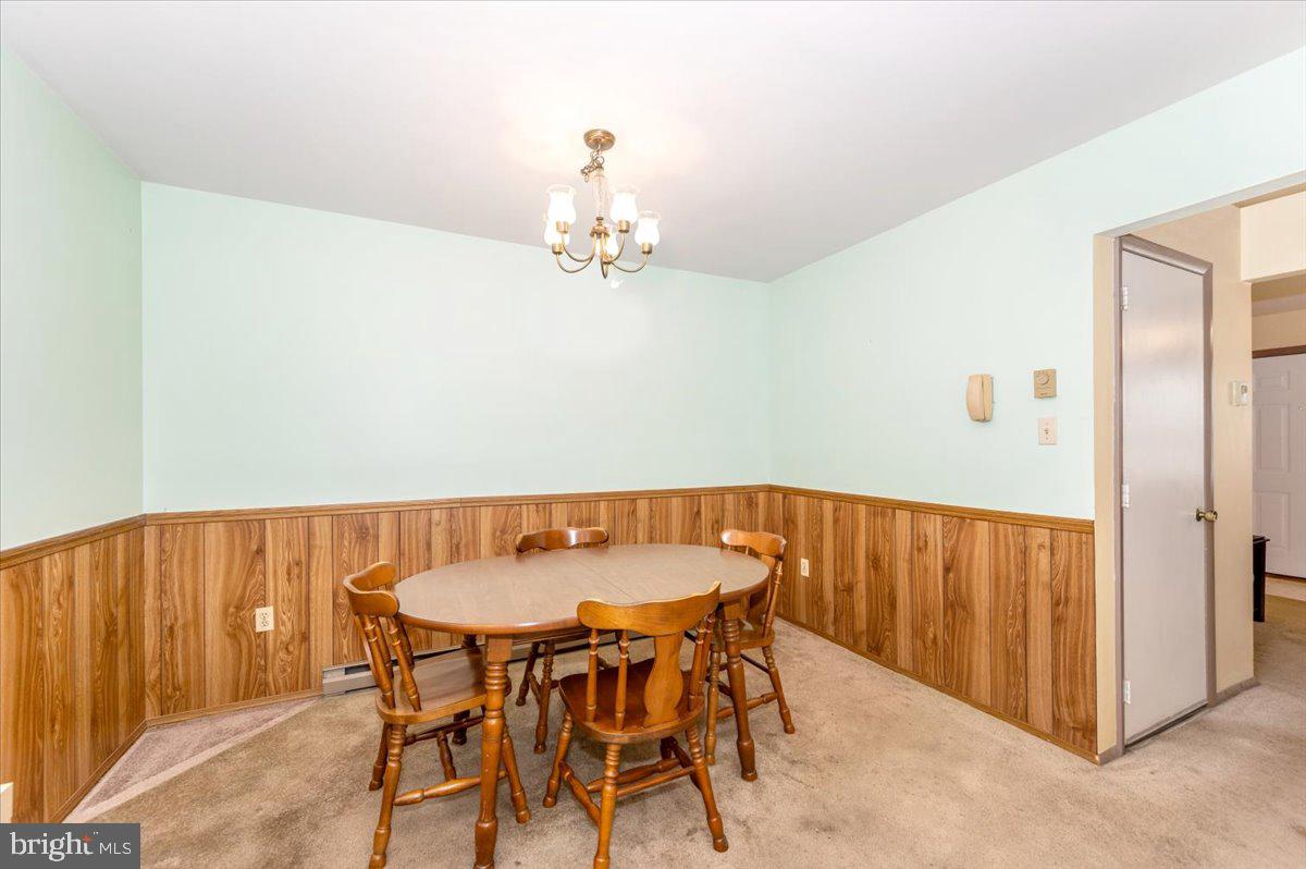 52 Wenner Drive Brunswick, MD 21716 - Photo 17 of 55 a view of a dining room with furniture and wooden floor