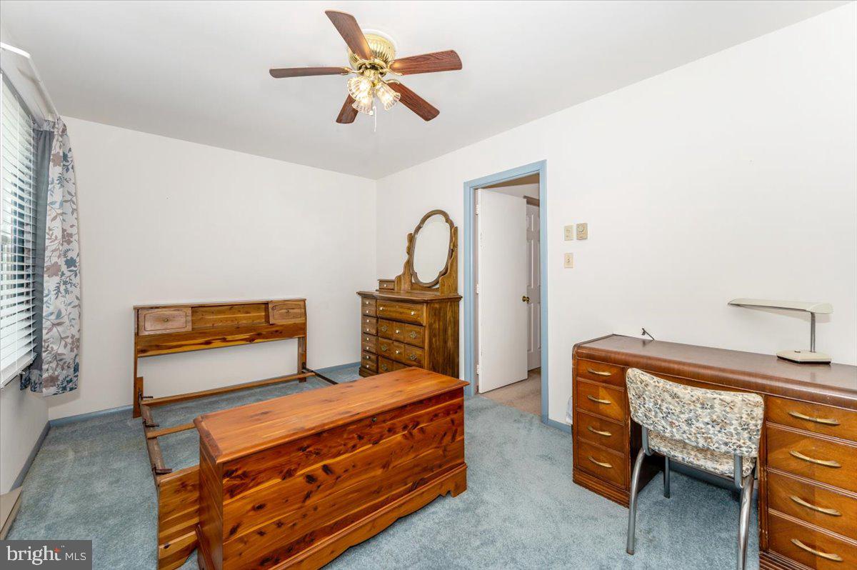 52 Wenner Drive Brunswick, MD 21716 - Photo 28 of 55 a bedroom with a bed and a chandelier