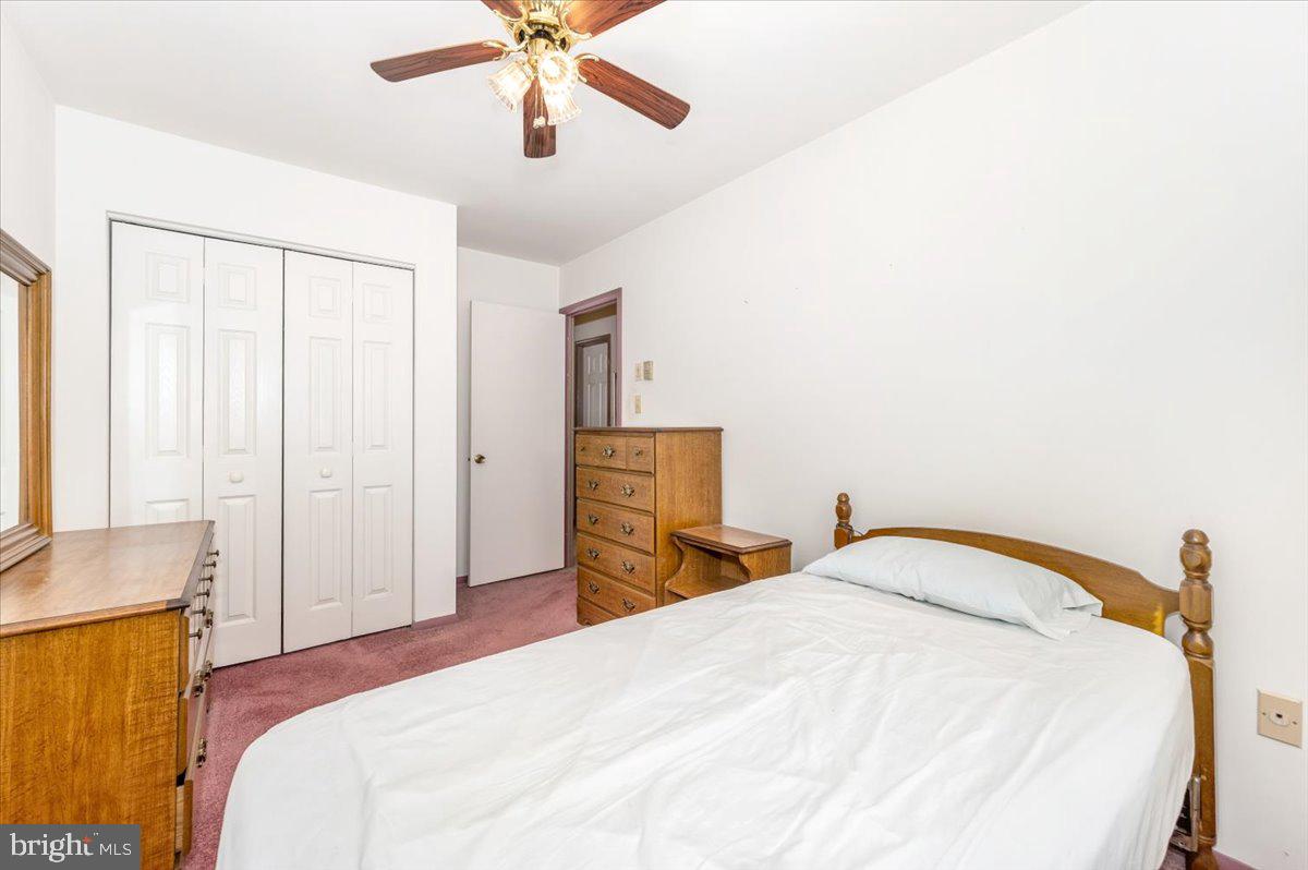 52 Wenner Drive Brunswick, MD 21716 - Photo 32 of 55 a bedroom with a bed and a chandelier