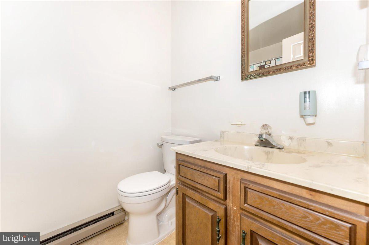 52 Wenner Drive Brunswick, MD 21716 - Photo 35 of 55 a bathroom with a granite countertop toilet and a sink