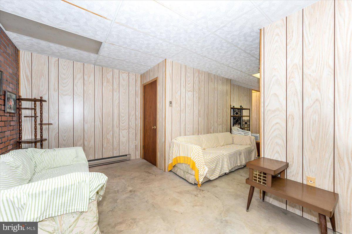 52 Wenner Drive Brunswick, MD 21716 - Photo 40 of 55 a spacious bedroom with a bed and a couch