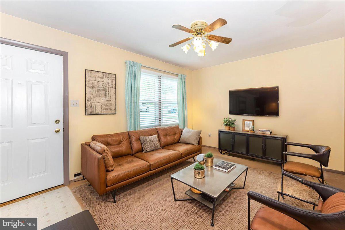 52 Wenner Drive Brunswick, MD 21716 - Photo 4 of 55 a living room with furniture and a flat screen tv