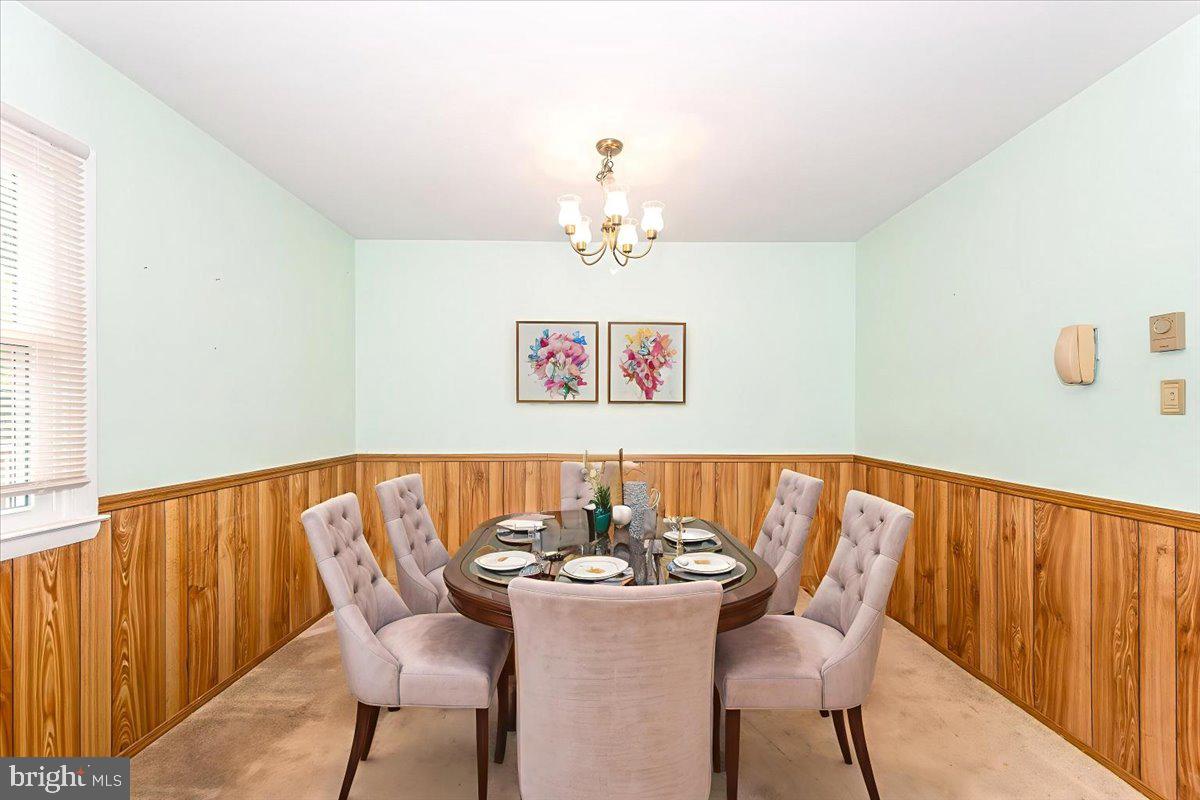 52 Wenner Drive Brunswick, MD 21716 - Photo 5 of 55 a view of a dining room with furniture and wooden floor