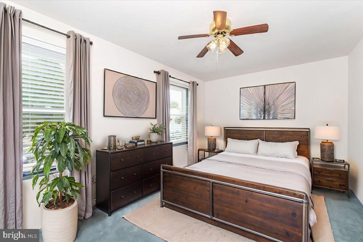 52 Wenner Drive Brunswick, MD 21716 - Photo 7 of 55 a bedroom with a bed and a potted plant