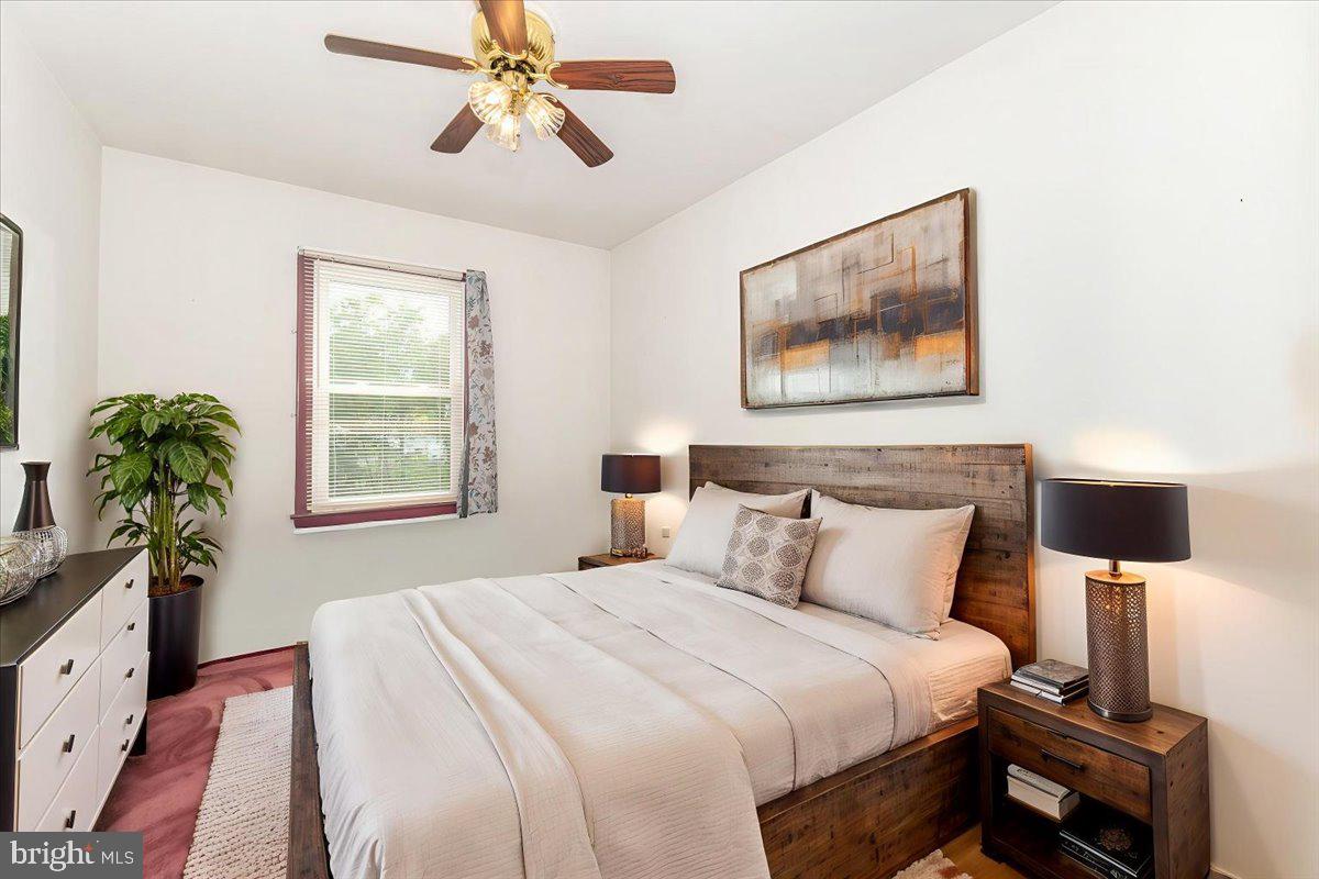 52 Wenner Drive Brunswick, MD 21716 - Photo 8 of 55 a bedroom with a bed and a potted plant