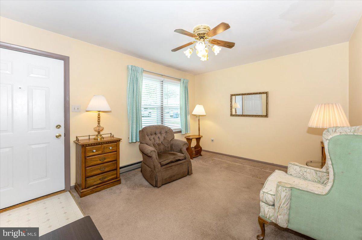 52 Wenner Drive Brunswick, MD 21716 - Photo 10 of 55 a bedroom with a bed and a chandelier