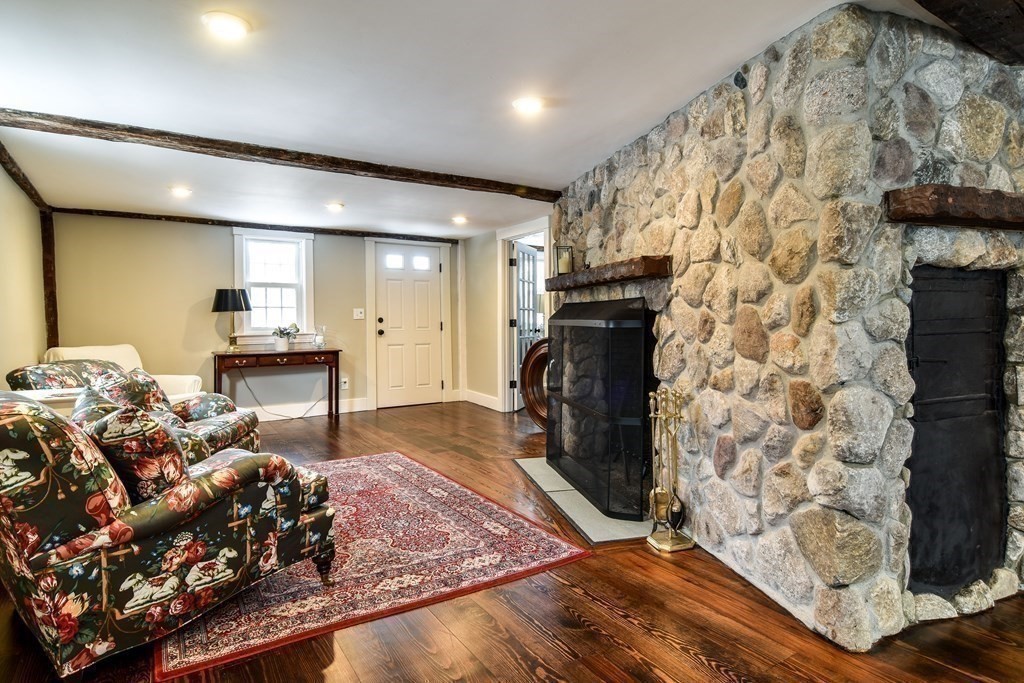85 Walpole Street Dover, MA 02030 - Photo 13 of 39 a living room with furniture and a fireplace
