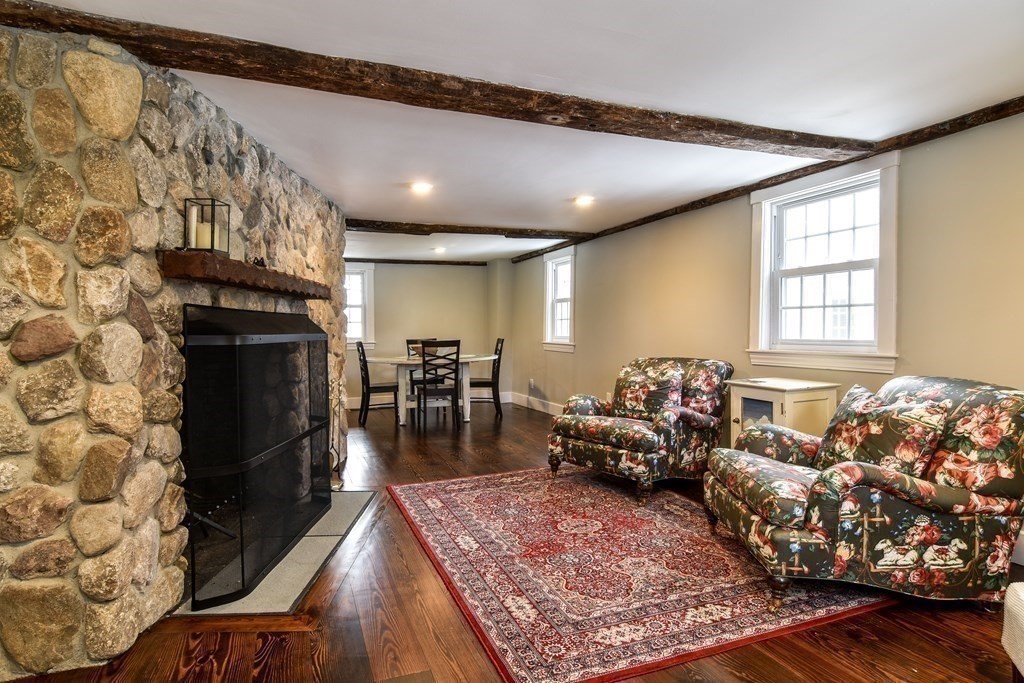 85 Walpole Street Dover, MA 02030 - Photo 14 of 39 a living room with furniture and a fireplace