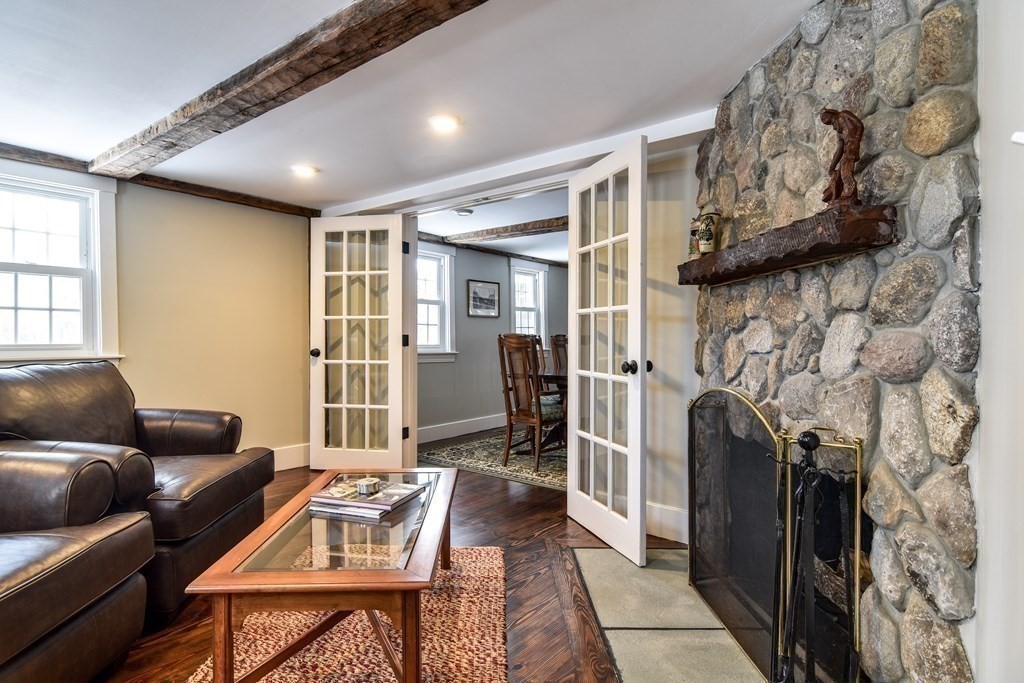 85 Walpole Street Dover, MA 02030 - Photo 16 of 39 a living room with furniture and a fireplace