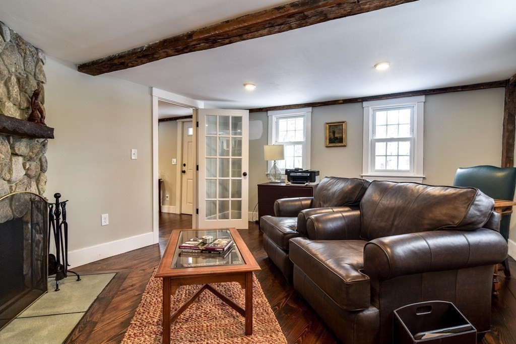 85 Walpole Street Dover, MA 02030 - Photo 17 of 39 a living room with furniture a flat screen tv and a window