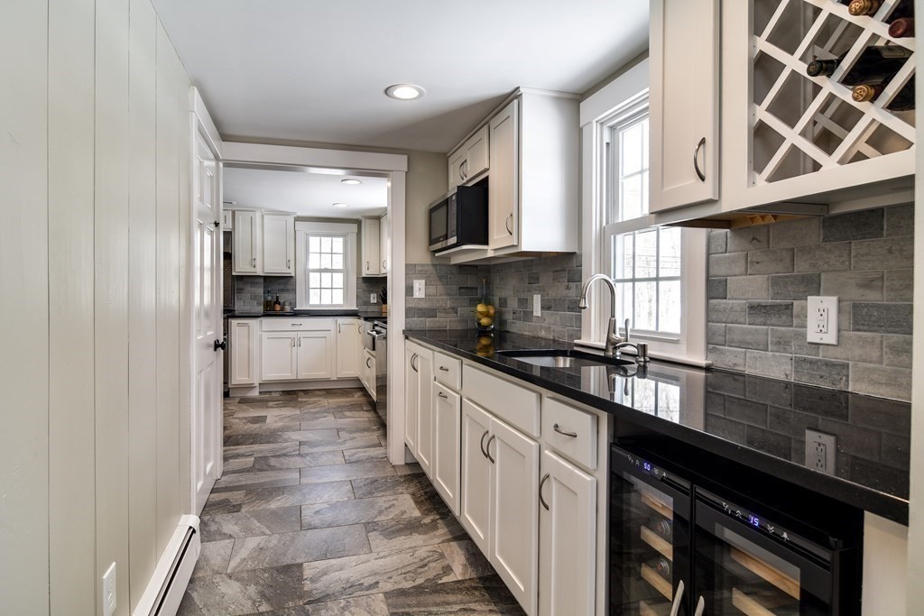 85 Walpole Street Dover, MA 02030 - Photo 22 of 39 a kitchen with stainless steel appliances granite countertop a sink and cabinets
