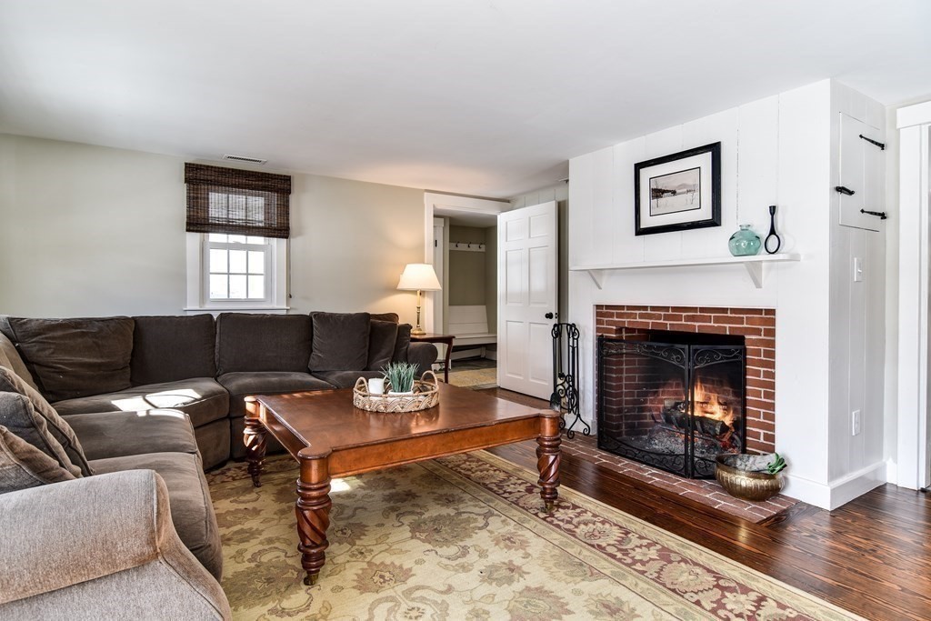 85 Walpole Street Dover, MA 02030 - Photo 23 of 39 a living room with furniture and a fireplace