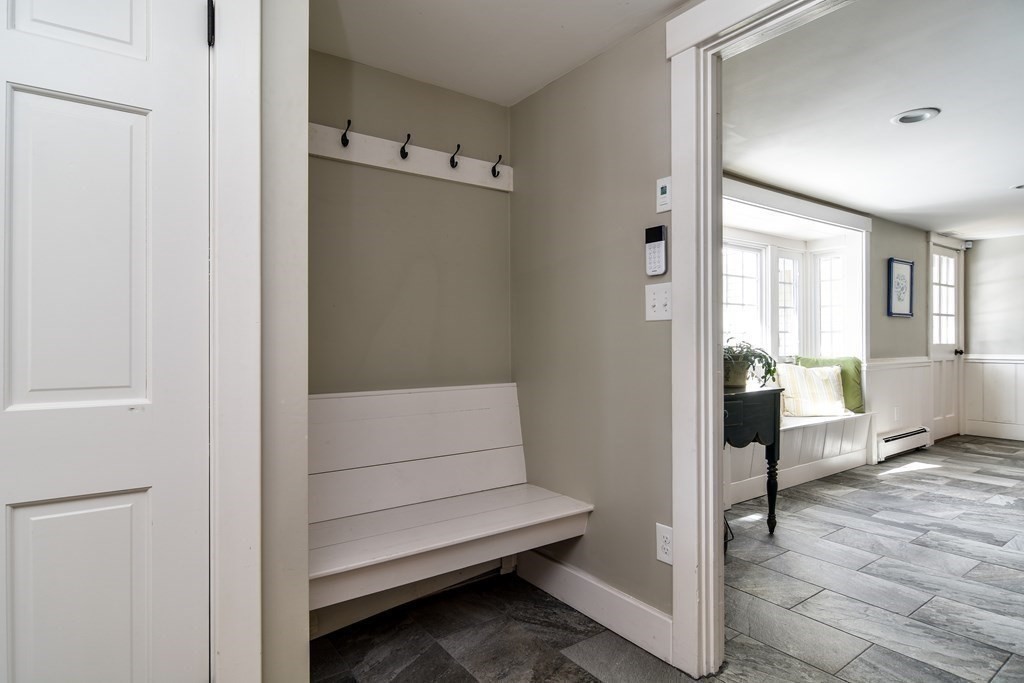 85 Walpole Street Dover, MA 02030 - Photo 25 of 39 a view of a hallway with bathroom and wooden floor