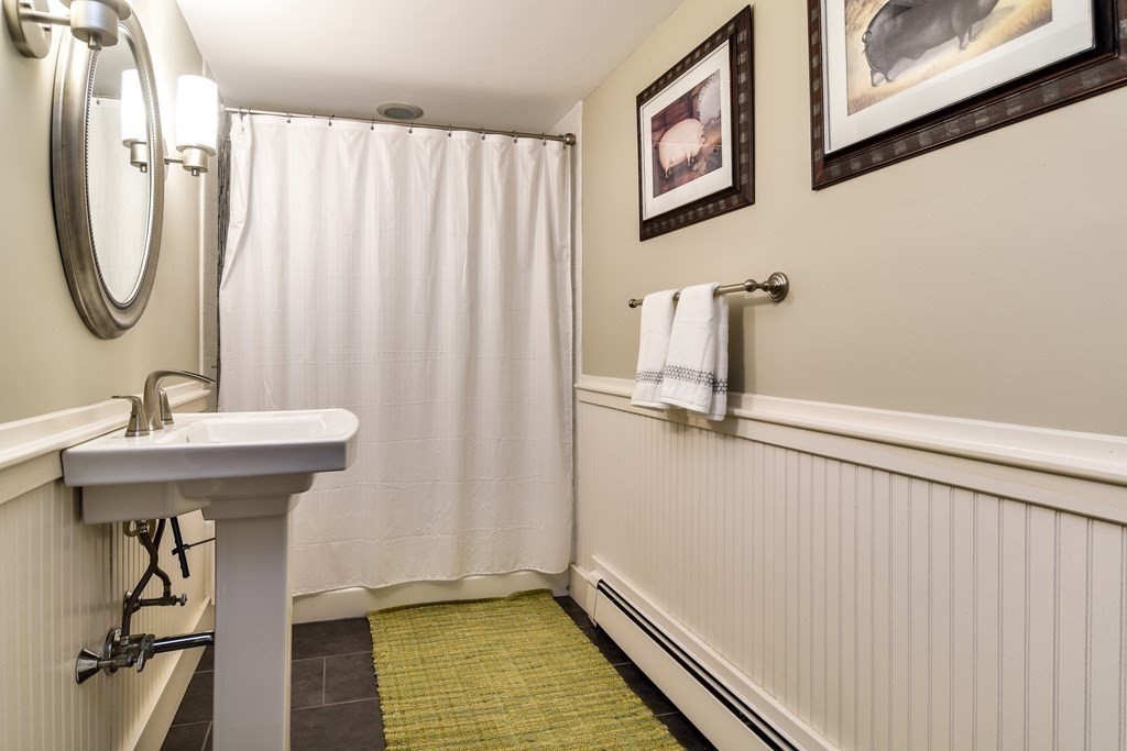 85 Walpole Street Dover, MA 02030 - Photo 26 of 39 a bathroom with a sink a mirror and a shower