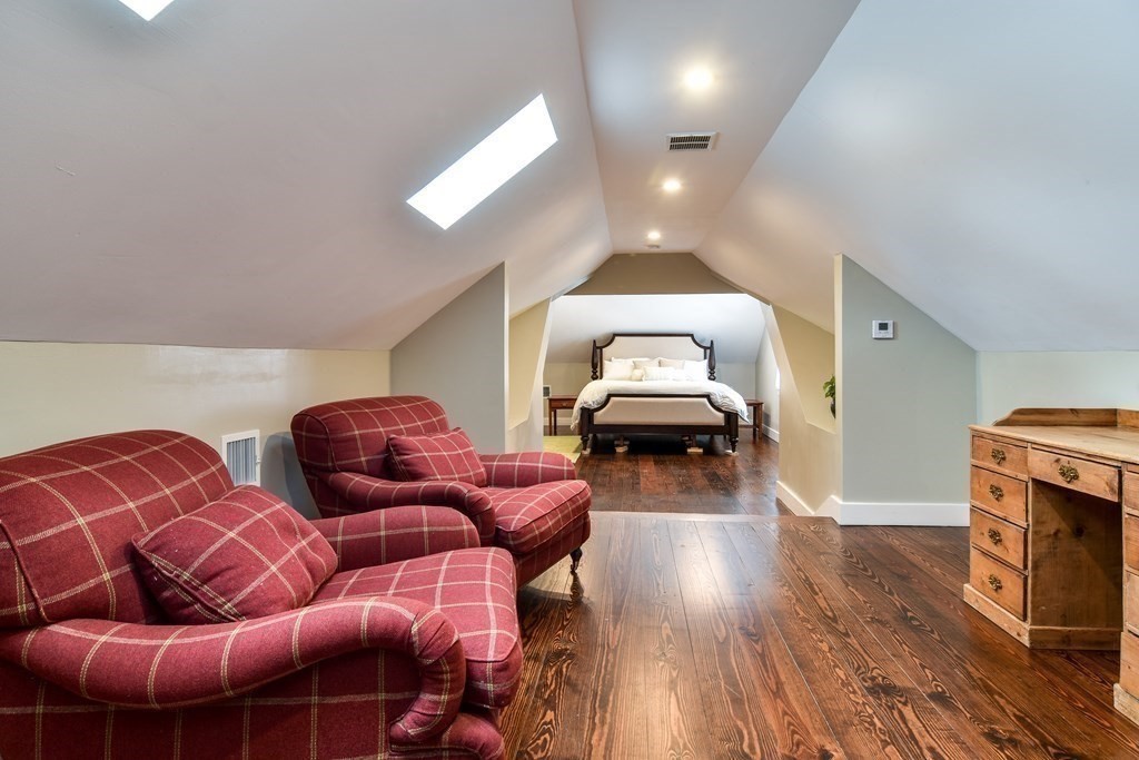 85 Walpole Street Dover, MA 02030 - Photo 32 of 39 a living room with furniture a flat screen tv and a fireplace