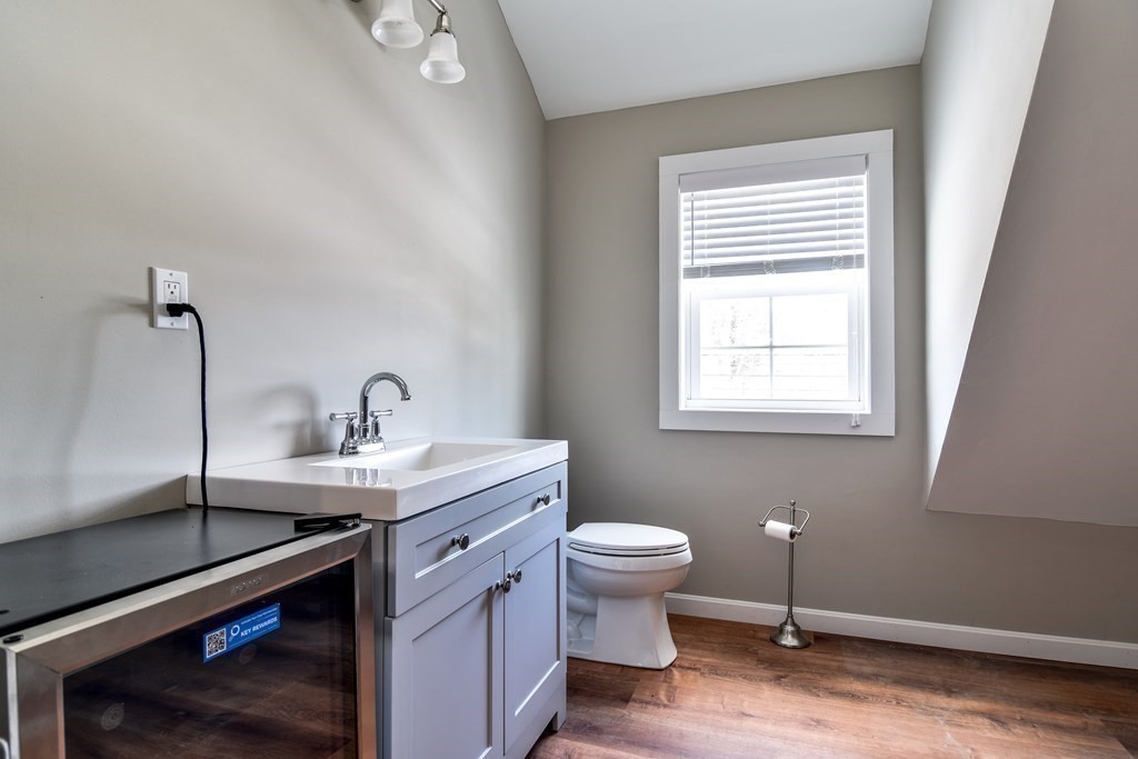 85 Walpole Street Dover, MA 02030 - Photo 36 of 39 a bathroom with a sink toilet and window