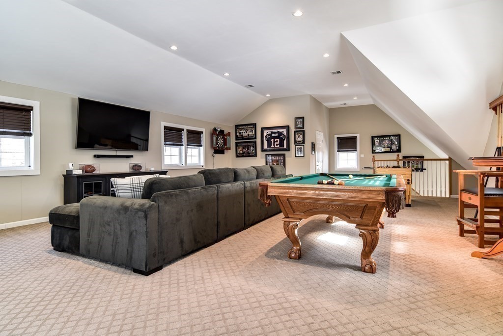 85 Walpole Street Dover, MA 02030 - Photo 38 of 39 a living room with furniture and a flat screen tv