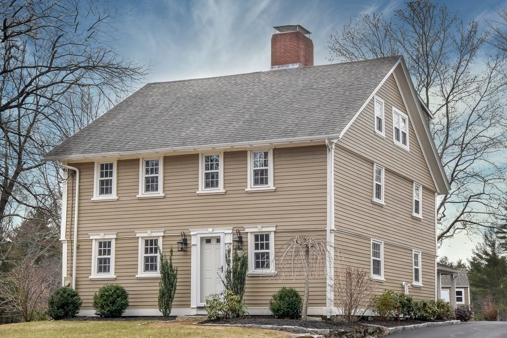 85 Walpole Street Dover, MA 02030 - Photo 4 of 39 a front view of a house with a yard